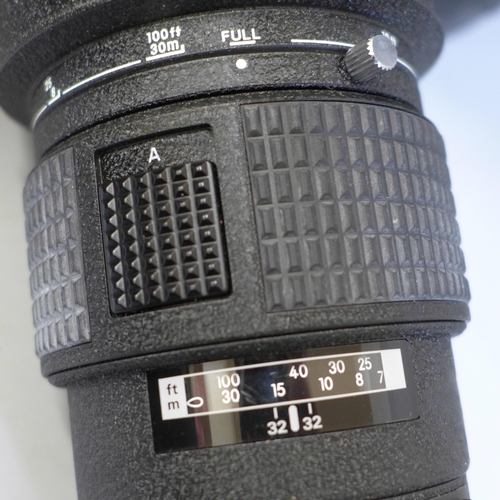 767 - A Nikon ED AF Nikkor 300mm 1:4 telephoto lens with case