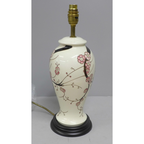 832 - A Moorcroft Sakura table lamp with shade, boxed