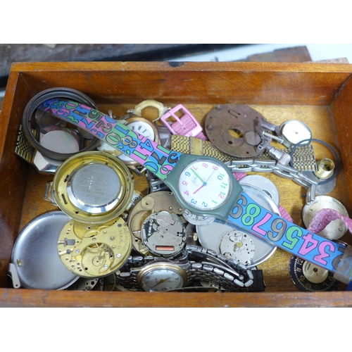 844 - A cabinet with drawers and lockable front with a collection of watch spares