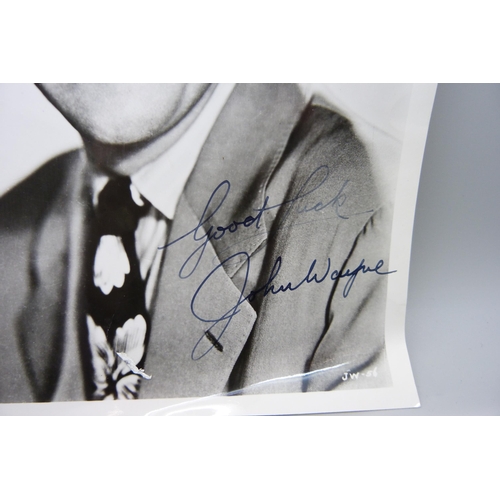 855 - A John Wayne printed autograph picture, 20.5cm wide