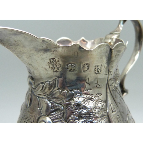 887 - A George III silver jug, London 1772, Ann Smith & Nathaniel Appleton, with later inscription dated 1... 