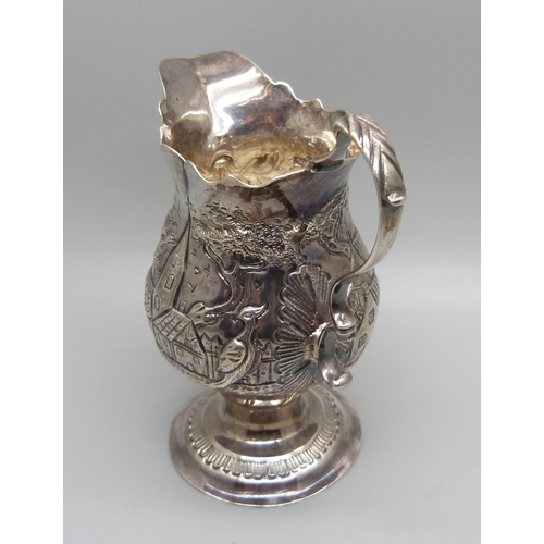 887 - A George III silver jug, London 1772, Ann Smith & Nathaniel Appleton, with later inscription dated 1... 