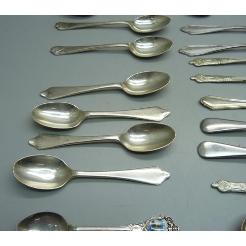 891 - Collectors spoons; including 102g of hallmarked silver and 36g of .800 silver