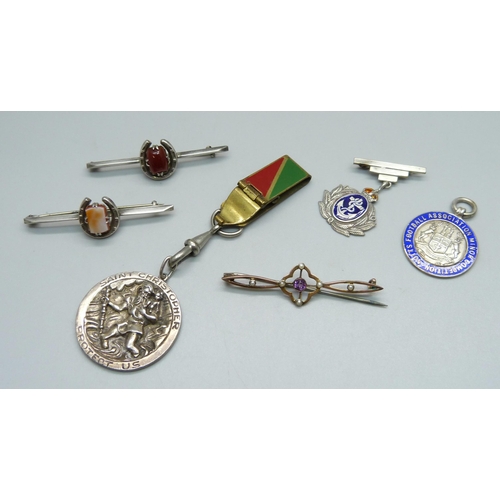 976 - A silver St. Christopher, a silver and enamel fob medal, Notts FA Minor Competition, a silver Navy s... 