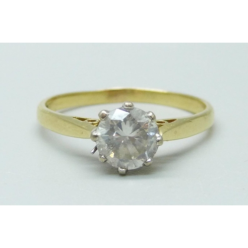 982 - An 18ct gold and diamond solitaire ring, round brilliant cut diamond, claw set in white gold with op... 