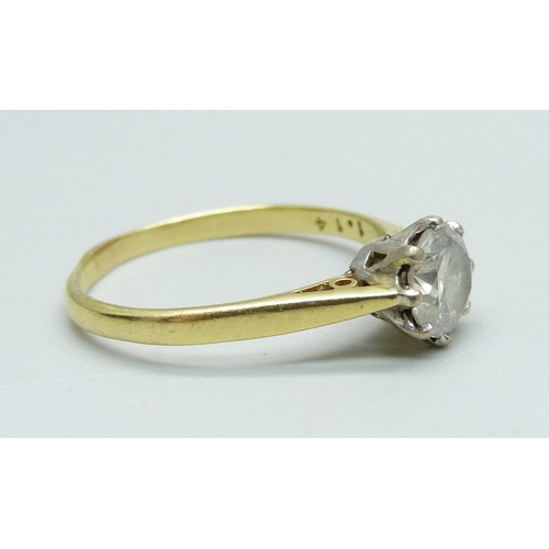 982 - An 18ct gold and diamond solitaire ring, round brilliant cut diamond, claw set in white gold with op... 