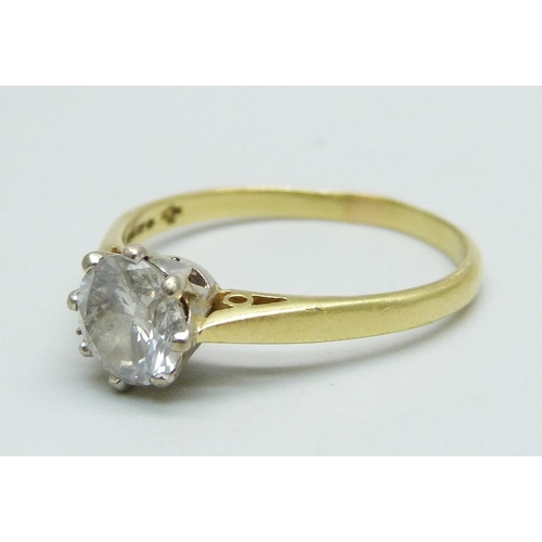 982 - An 18ct gold and diamond solitaire ring, round brilliant cut diamond, claw set in white gold with op... 