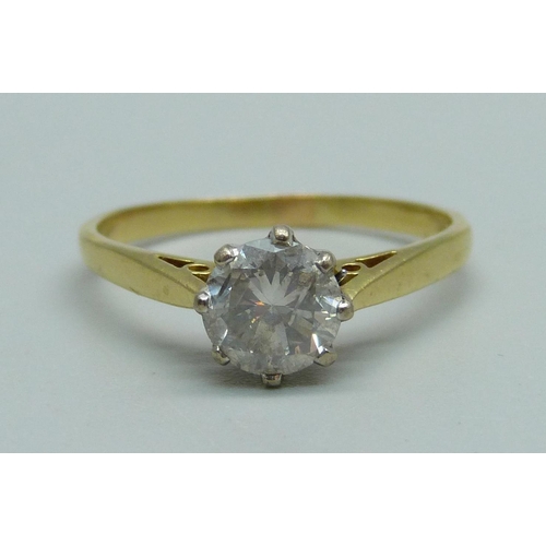 982 - An 18ct gold and diamond solitaire ring, round brilliant cut diamond, claw set in white gold with op... 