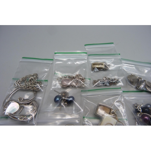 993 - Ten pairs of silver earrings, five silver pendants and chains and a silver bracelet