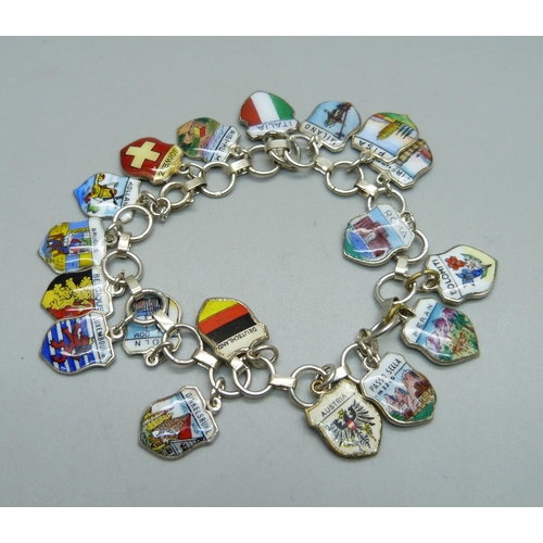 994 - A silver bracelet with enamelled charms, some 800 silver and some unmarked