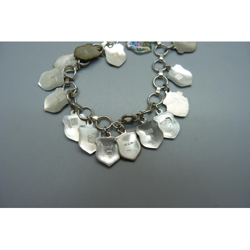 994 - A silver bracelet with enamelled charms, some 800 silver and some unmarked