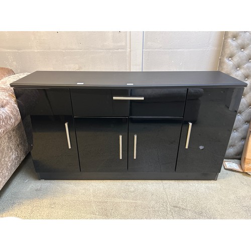 1583 - A black high gloss four door sideboard