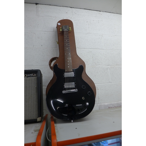 2101 - A Gibson Les Paul studio electric guitar (serial no. S2897436) with a Fender Champion 30 and hard gu... 