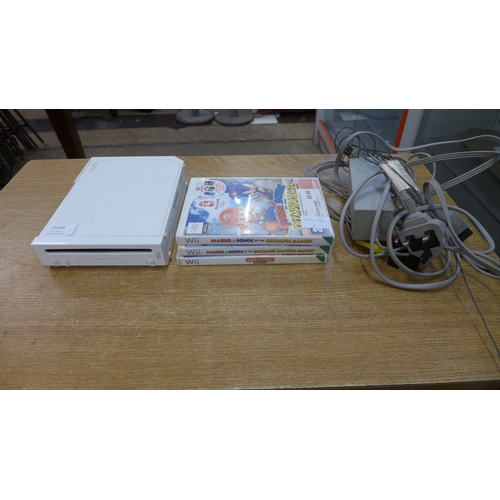 2134 - A Wii console with leads and games