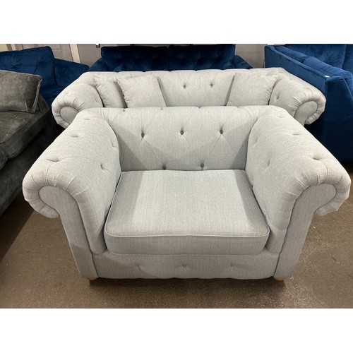 1470 - A light grey textured weave Chesterfield style three seater sofa and love seat