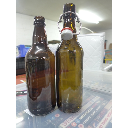 2405 - A box of 18 brown glass beer bottles