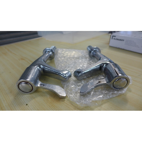 2335 - A quantity of chrome plated brass taps and fittings