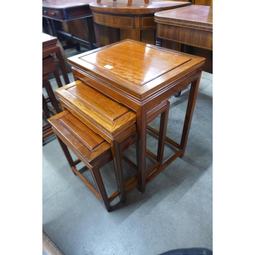 146 - A Chinese carved hardwood nest of tables