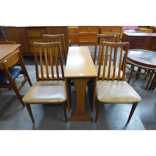 23 - A G-Plan Fresco teak drop leaf table and four chairs