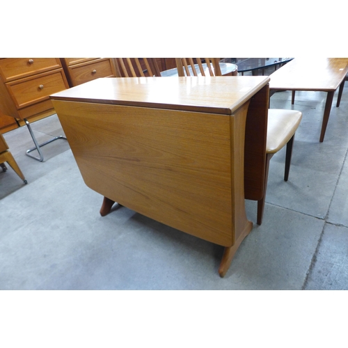 23 - A G-Plan Fresco teak drop leaf table and four chairs