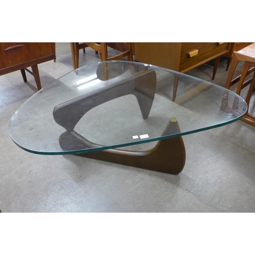 26 - An Isamu Noguchi style beech and glass topped coffee table