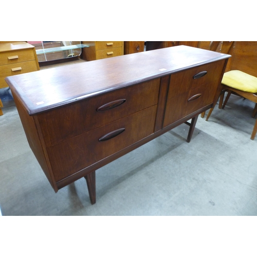 27 - A teak four drawer sideboard