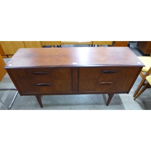 27 - A teak four drawer sideboard