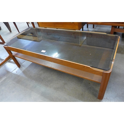 29 - A Myer teak and glass topped rectangular coffee table