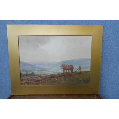 309 - J.W. Kelly, rural landscape with farmer ploughing fields, watercolour, dated 1925, unframed