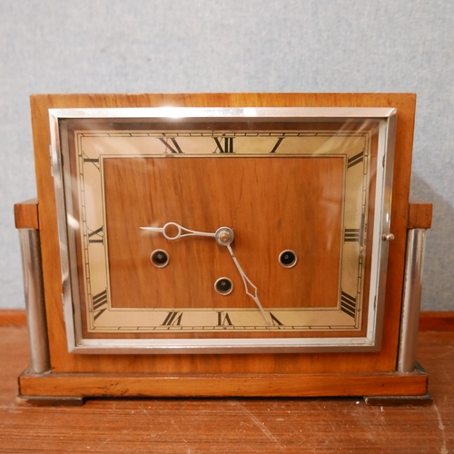 336 - An Art Deco walnut mantel clock