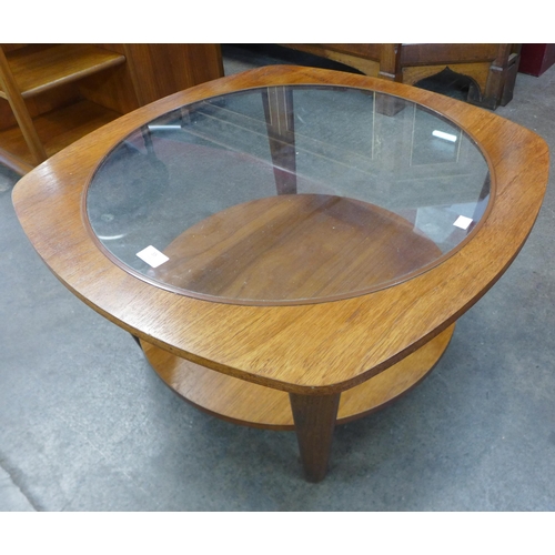 35 - A teak and glass topped coffee table