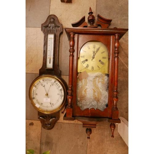 369 - An Edward VII oak aneroid barometer and a mahogany wall clock