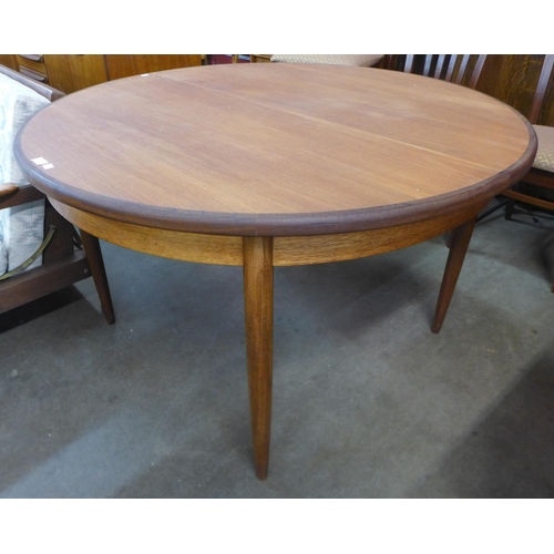 40 - A G-Plan Fresco teak circular extending dining table