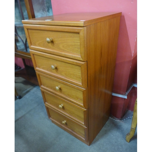 47 - A G-Plan teak chest of drawers and a teak and tiled top two tier trolley