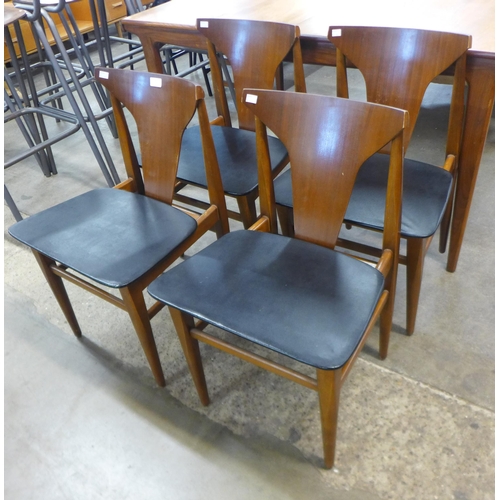 49 - A set of four teak dining chairs