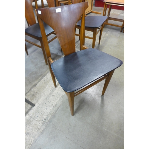 49 - A set of four teak dining chairs