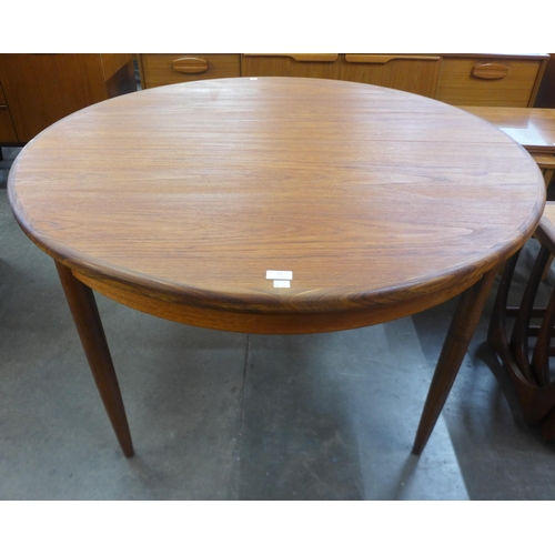 51 - A G-Plan Fresco teak circular extending dining table