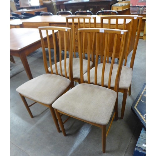 52 - A set of four teak dining chairs