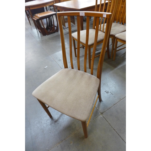 52 - A set of four teak dining chairs