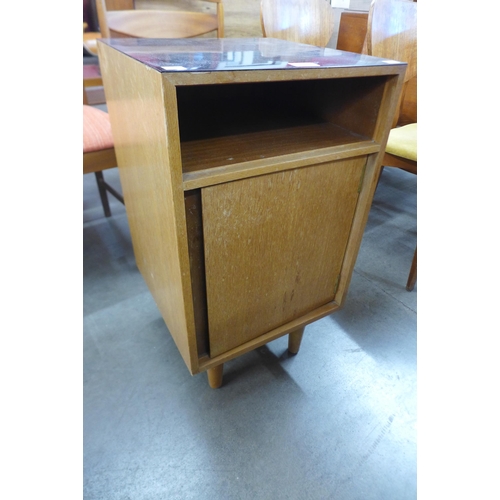 62 - A Stag C-Range oak bedside cupboard, designed by John & Sylvia Reid