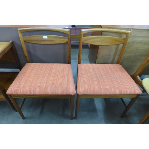 65 - A pair of McIntosh teak dining chairs