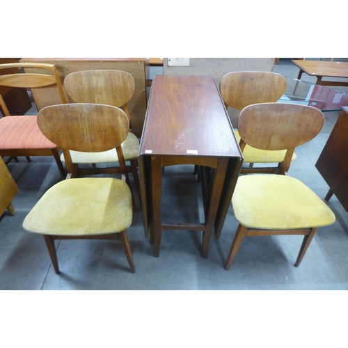 66 - A teak drop leaf dining table and four chairs