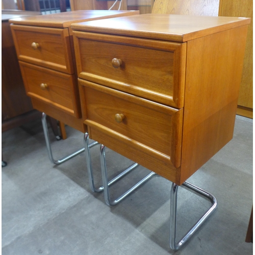 67 - A pair of G-Plan teak two drawer chests on chrome tubular stands