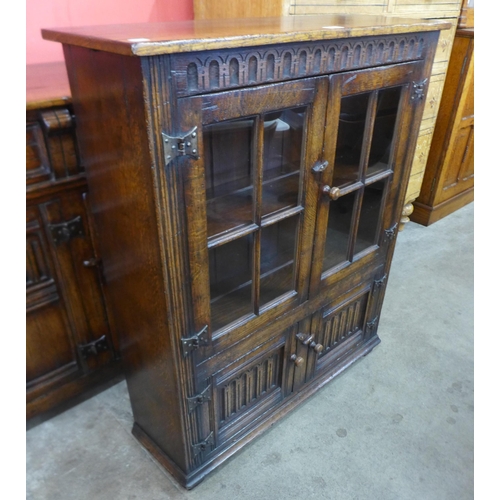 87 - A 17th Century style Titchmarsh & Goodwin carved Ipswich oak bookcase