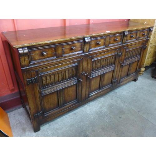 88 - A 17th Century style Titchmarsh & Goodwin carved Ipswich oak sideboard