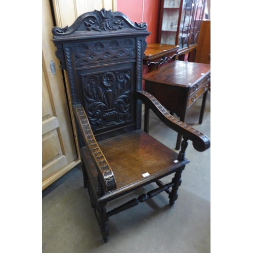 97 - A 17th Century style carved oak Wainscott chair