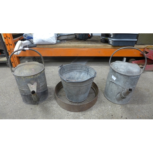 2259 - Two metal watering cans, a metal bucket and a sieve