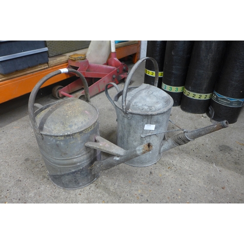 2259 - Two metal watering cans, a metal bucket and a sieve