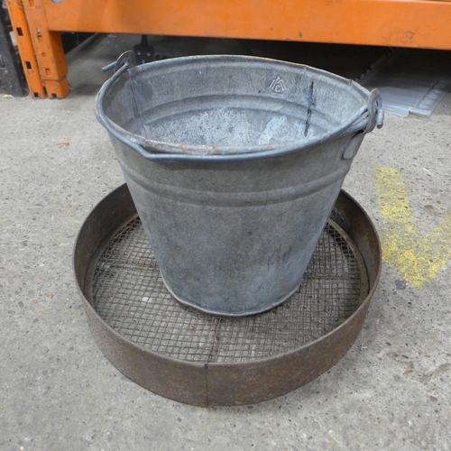 2259 - Two metal watering cans, a metal bucket and a sieve