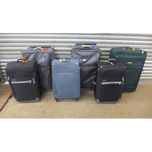 2310 - Six assorted suitcases